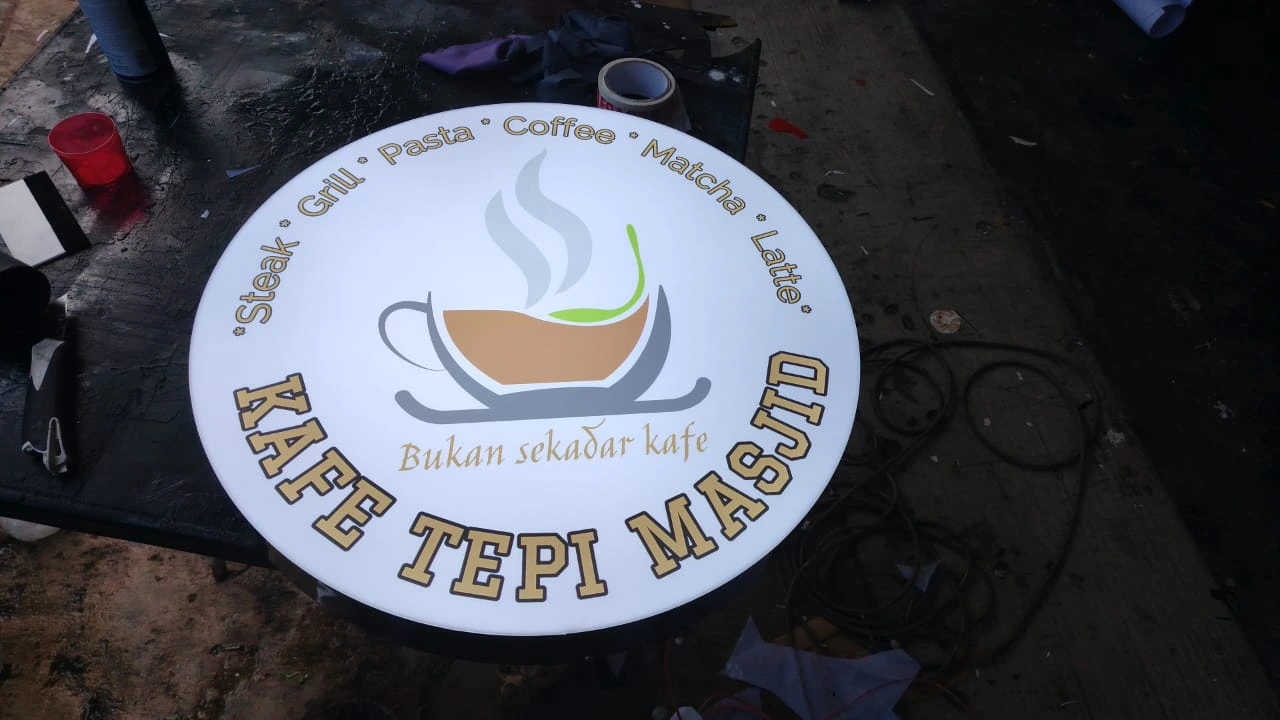 Round lightbox signboard for Kafe Tepi Masjid with LED lighting and modern cafe branding design in Malaysia.